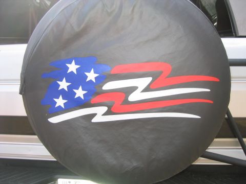 1996 Ford Bronco - A spare tire cover displays a stylized American flag graphic.