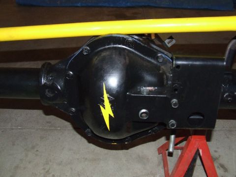 1986 Ford Bronco - Close-up of a vehicle's rear axle differential, a yellow lightning bolt decal.