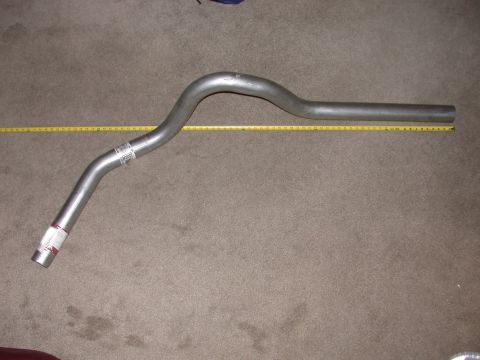 1995 Ford Bronco - An exhaust pipe is shown with a yellow measuring tape for scale.