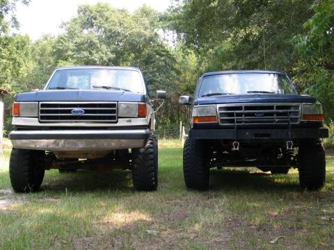 1989 Ford F-150 - Two Ford trucks, one from the late 1980s and another from the early 1990s, are parked side-by-side.