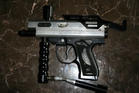 2004 Jeep TJ - This paintball gun has a black foregrip and a silver body with black accents.