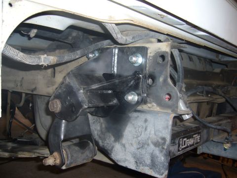 1992 Ford Bronco - Custom shackle flip bracket installed on the rear suspension of a vehicle, likely for lift modification.