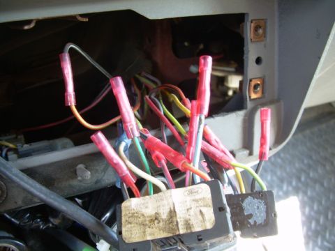 1988 Ford Bronco - Close-up of a vehicle's wiring harness, a label with the Ford logo.