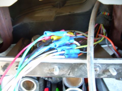 1988 Ford Bronco - Close-up of a vehicle's wiring harness with many colorful wires and blue connectors.