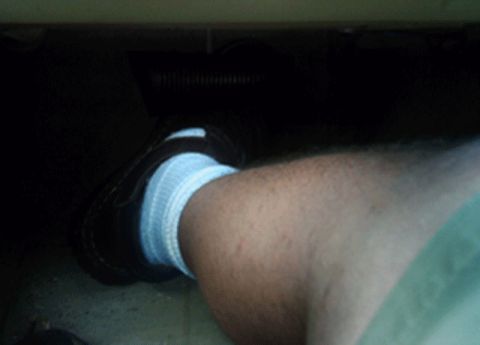 1985 Ford Crown Victoria LTD - A person's foot wearing a sock is visible inside the vehicle's interior.