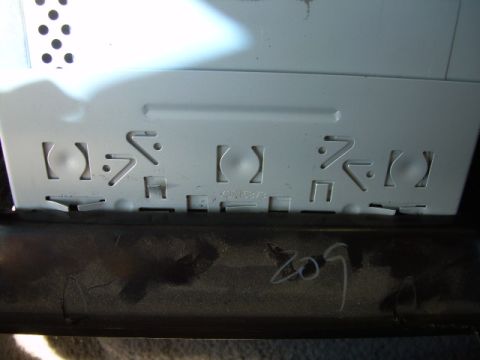 1988 Ford Bronco - A car stereo mounting bracket is shown, with no visible vehicle identification.