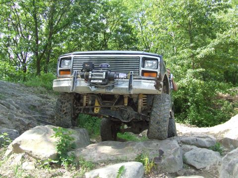 1986 Ford Bronco - This 1986 Ford Bronco is tackling a rocky trail with its front end high.