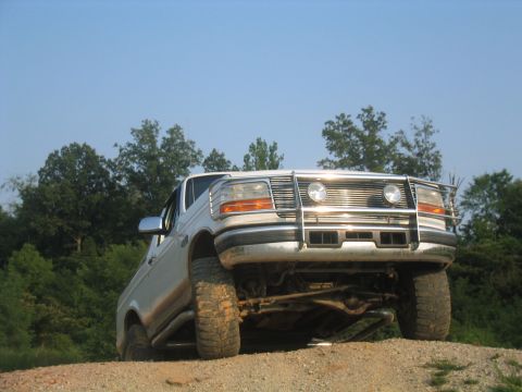 1996 Ford Bronco - Front view of a 1992 Ford F-Series truck on an incline, equipped with a brush guard.