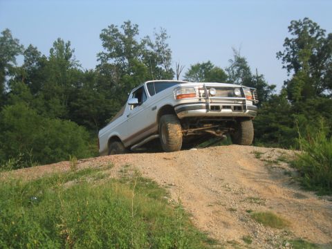 1996 Ford Bronco - This 1996 Ford Bronco is shown navigating an off-road trail on a sunny day.