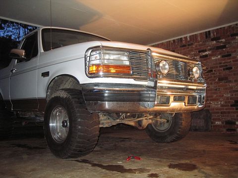 1996 Ford Bronco - Front view of a lifted 1992 Ford Bronco showing its grille and bumper.