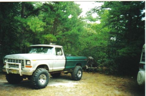 1979 Ford F-250 - This lifted 1979 Ford F-250 pickup truck features a two-tone paint scheme and off-road tires.