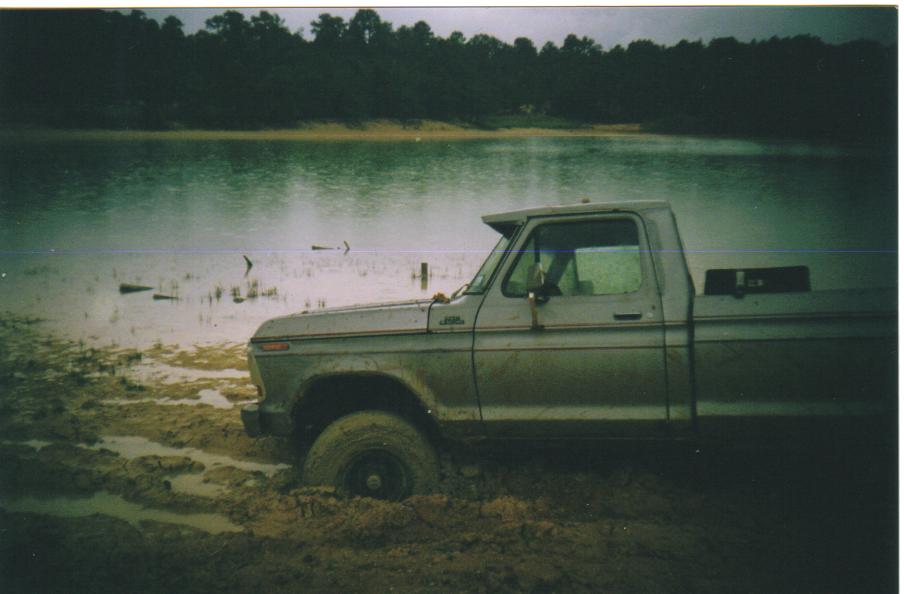 1979 Ford F-250 side view, stuck in mud by water