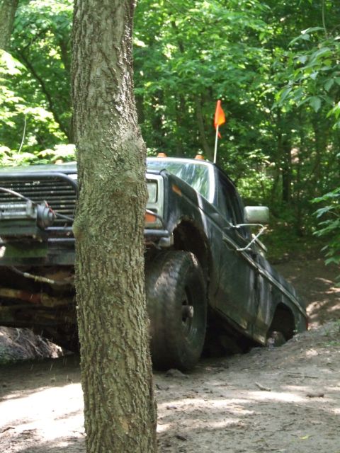 1986 Ford Bronco - This 1986 Ford Bronco is navigating a muddy off-road trail.