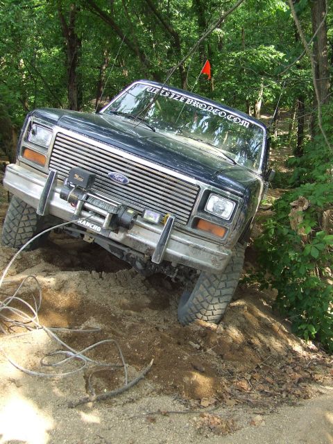 1986 Ford Bronco - This 1986 Ford Bronco navigates a challenging off-road course with a winch mounted on the front bumper.