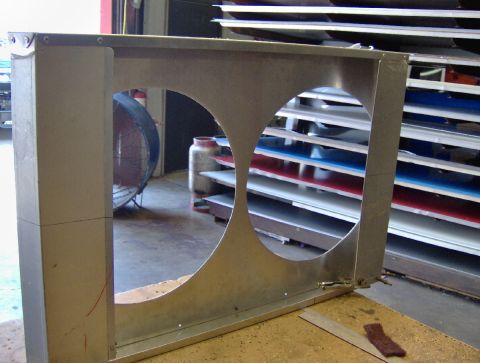 1978 Ford Bronco - This is a radiator shroud, likely for a vehicle, with two large circular openings for fans or radiators.