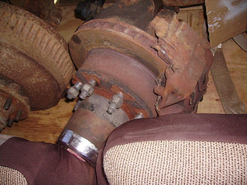 rusted brake rotor and hub assembly with lug nuts