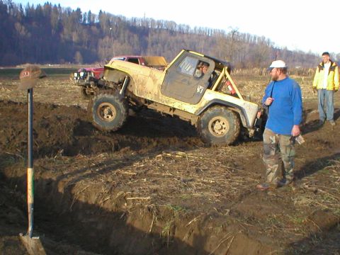 1978 Ford Bronco - Off-road vehicle attempts to navigate a muddy terrain, getting stuck in the process.
