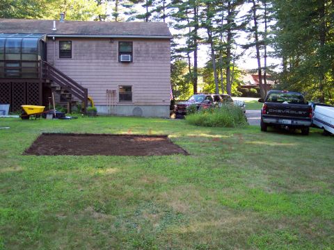 2001 Ford Crown Victoria - A black Chevrolet pickup truck is parked in the driveway next to a house and other vehicles.