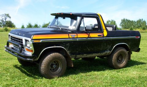 1978 Ford Bronco - This 1978 Ford Bronco is shown from a three-quarter front angle, parked outdoors on a grassy field.