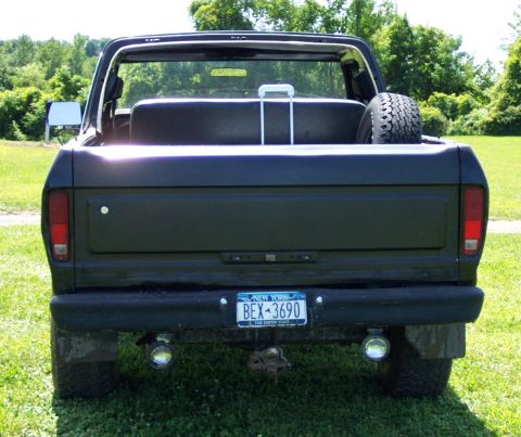 1978 Ford Bronco - This 1978 Ford Bronco is viewed from the rear, showing its tailgate and spare tire in the bed.