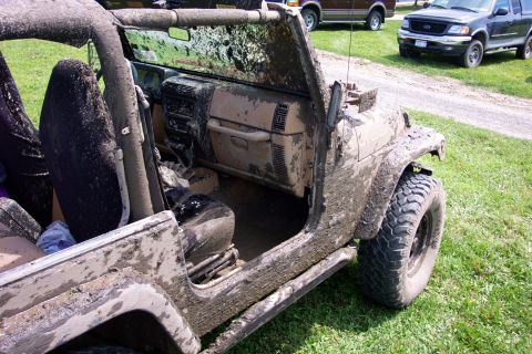 1978 Ford Bronco - Muddy Jeep interior and exterior detail, with two other vehicles visible in the background.
