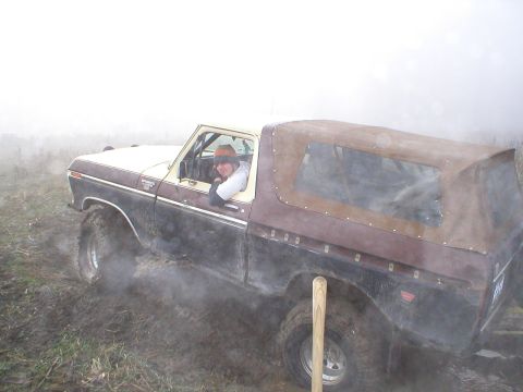 1978 Ford Bronco - The driver of a 1978 Ford Bronco navigates through a foggy, muddy terrain.