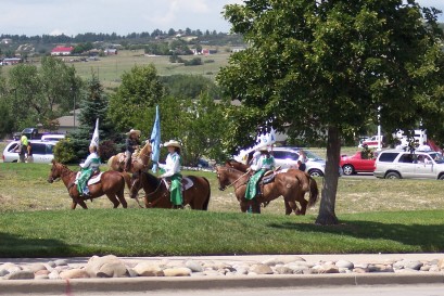 1972 Ford Ranchero - Riders on horseback participate in an event, with several vehicles visible in the background.