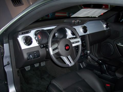 1972 Ford Ranchero - Interior view of a car's dashboard, steering wheel, and seats, showing the driver's side controls and console.