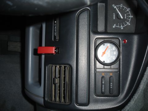 1996 Ford Bronco - Interior picture of the switch. To the top and left of the trans temp gauge you can see a little red light. That is the warning light for t…