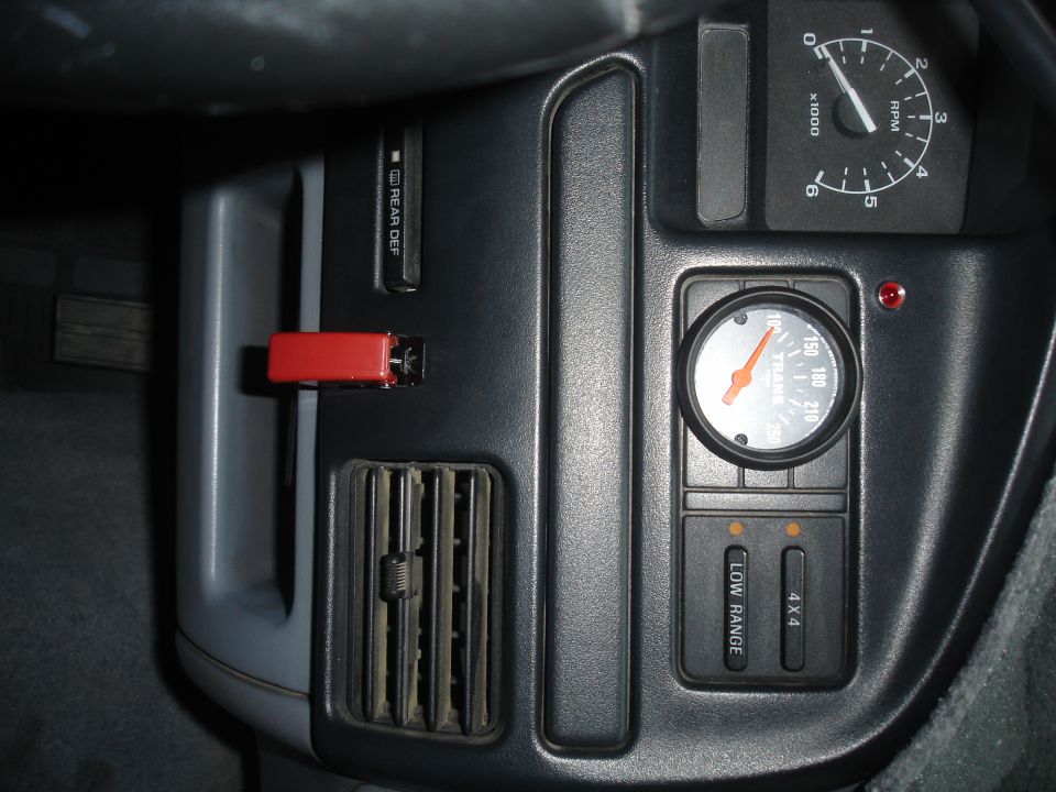 Interior picture of the switch. To the top and left of the trans temp gauge you can see a little red light. That is the warning light for the OBA to remind me it's on so I don't forget.