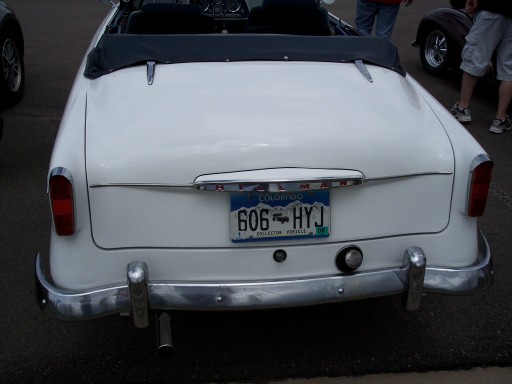 White convertible's rear with a Colorado license plate reading 606 HYJ