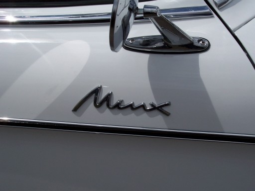 White car with a chrome 'Minx' badge and side mirror