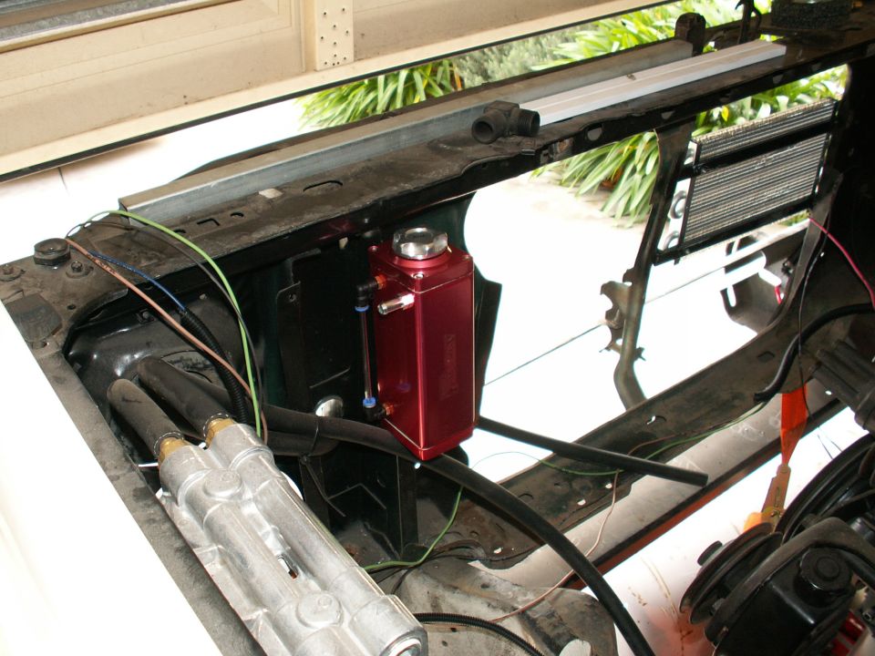 engine bay starting to look the goods - middle pic is new anodized alloy radiator overflow tank, top right the new transmission cooler can be seen, bottom of pic you can see top of Perma Cool twin remote oil filter mount. Going to be a serious and good looking engine bay.