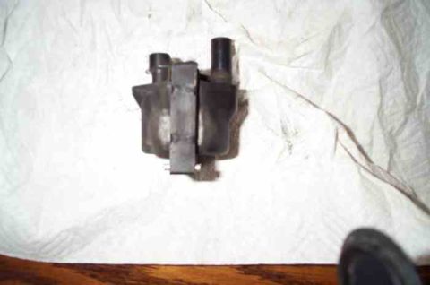 1988 Ford Bronco - A close-up view of a vehicle's ignition coil pack, likely removed for inspection or replacement.