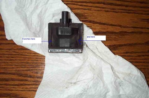 1988 Ford Bronco - A close-up of an automotive part with text visible, placed on a paper towel.