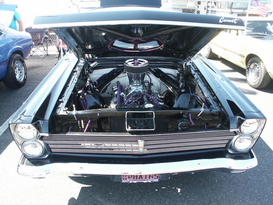 Black 1966 Mercury Comet front view with hood open, custom engine