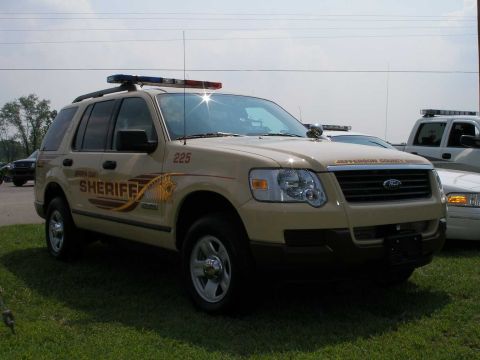1998 Ford Crown Victoria - A Jefferson County Sheriff's SUV is parked on grass with other vehicles in the background.