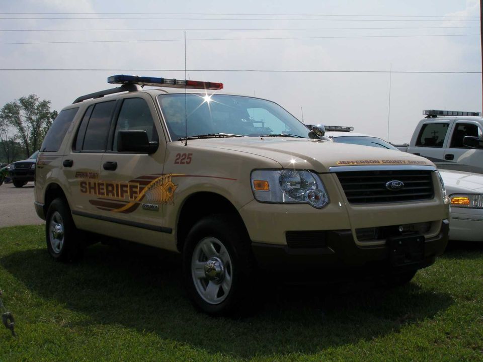 Tan Ford Explorer Jefferson County Sheriff SUV, unit 225, parked on grass