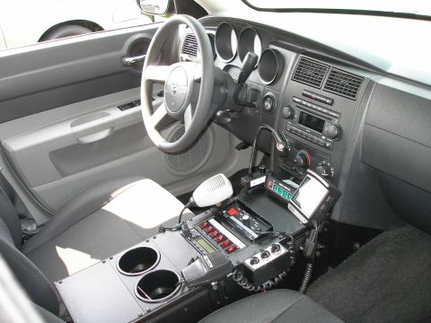 1998 Ford Crown Victoria - Police car interior equipped with communication and control devices.