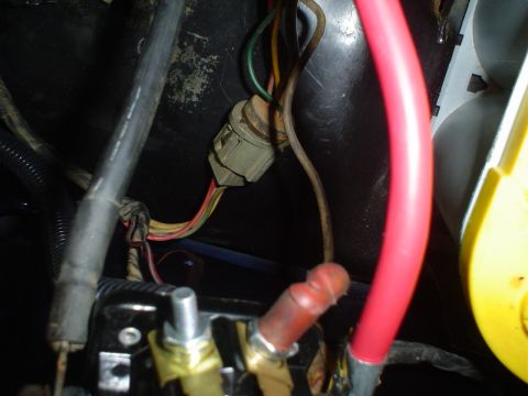 1984 Ford Bronco - This image shows a close-up view of a vehicle's electrical wiring and connectors, likely in the engine bay.