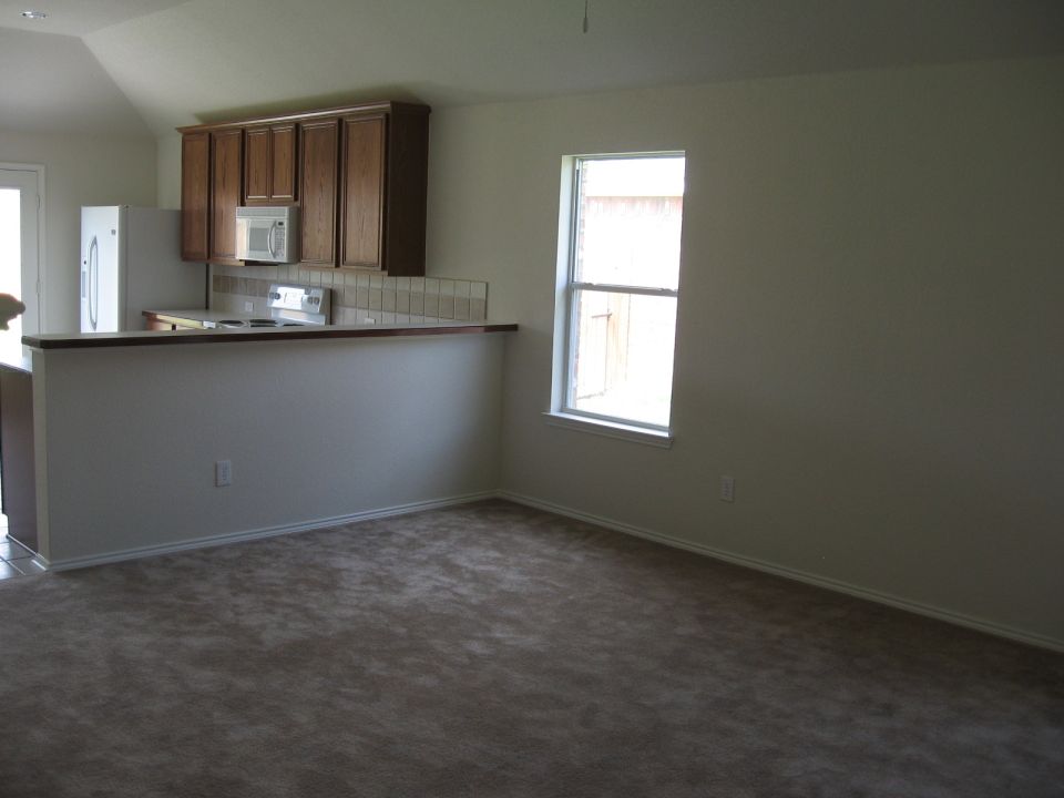 Interior of a house showing a kitchen and living area