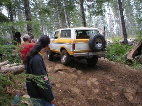 1978 Ford Bronco - 1978 Ford Bronco navigating a rocky, wooded off-road trail.