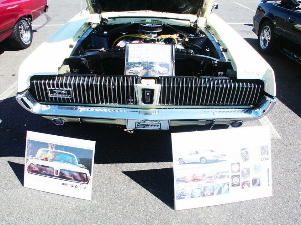 1969 Mercury Cougar XR7 front grille and engine bay with display boards