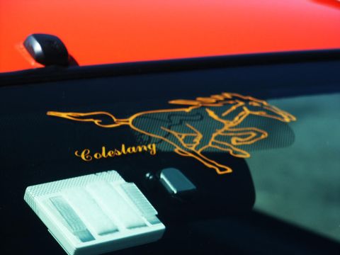 2001 Mercury Grand Marquis - A close-up shows an interior part with the 'Colestang' text and a running horse emblem.