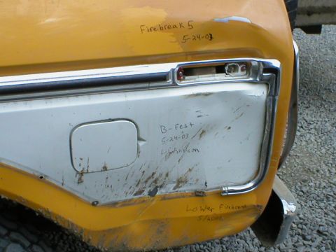 1978 Ford Bronco - Handwritten text on a yellow vehicle's rear quarter panel indicates event dates and a website.
