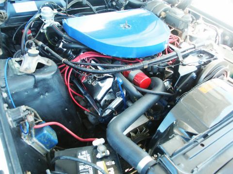 2001 Mercury Grand Marquis - Close-up view of a car's engine bay, showing various components and wiring.