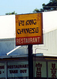 1968 Ford Mustang - A sign for a Chinese restaurant with a provocative name is shown, with additional text visible on the building below.