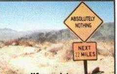 1968 Ford Mustang - Road signs indicate a long stretch of nothingness in a desert environment.
