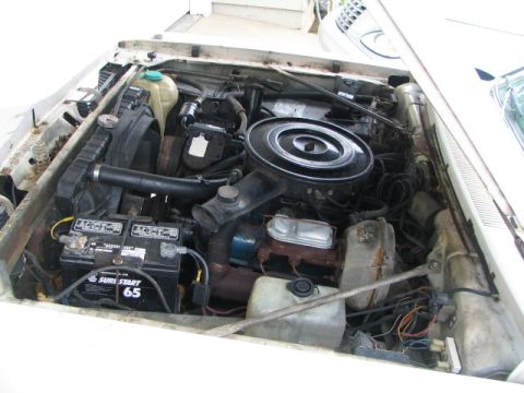 1975 Dodge Dart - The engine bay of a vehicle, showing various components and wiring.