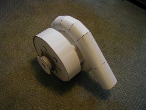 1993 Ford Probe - This is a model of a supercharger constructed from cardboard, placed on a carpeted floor.